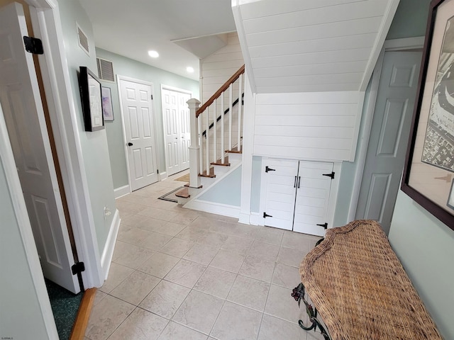 305 57th St Unit 305, Ocean City, NJ 08226 - foyer entrance with light tile patterned floors, visible vents, baseboards, recessed lighting, and stairs