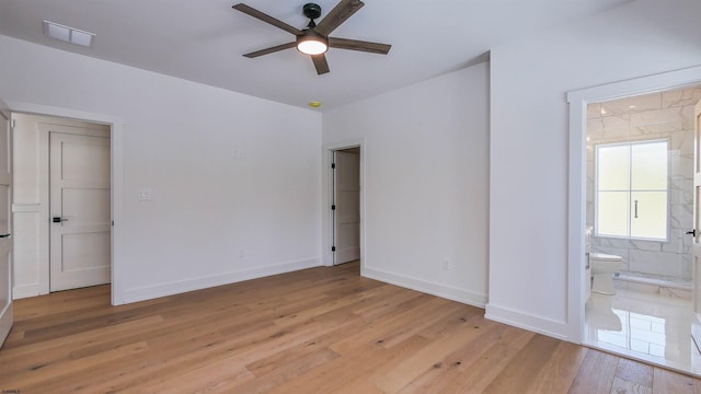 1535 Bear Branch Ct, Vineland, NJ 08362 - unfurnished bedroom with visible vents, connected bathroom, baseboards, and light wood-style floors