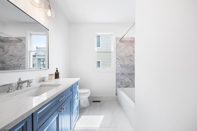 full bathroom with marble finish floor, toilet, vanity, visible vents, and washtub / shower combination