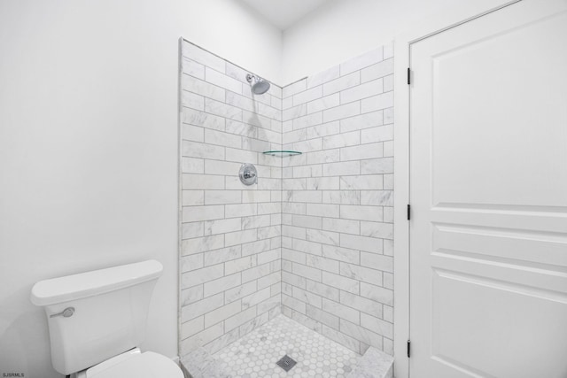 full bath with toilet and a shower stall