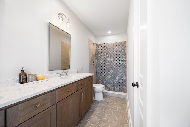 bathroom featuring recessed lighting, tile patterned flooring, toilet, vanity, and a stall shower