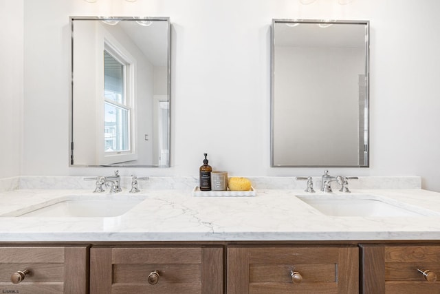 bathroom featuring double vanity and a sink