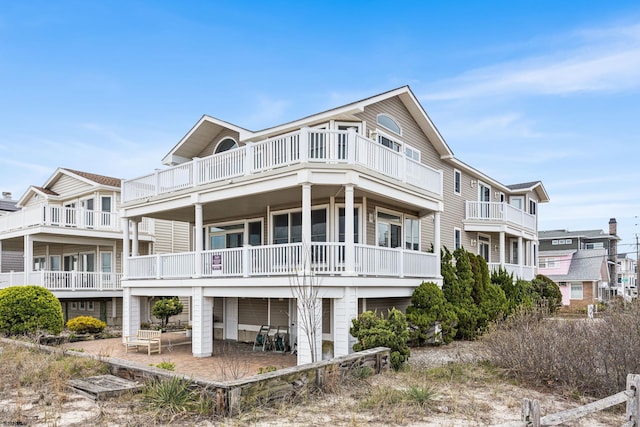 back of property featuring a balcony