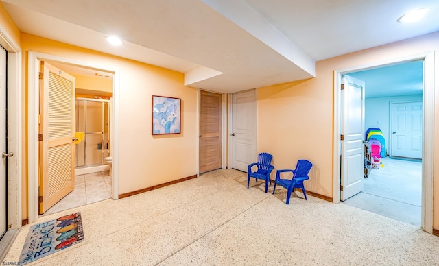 hallway featuring recessed lighting and baseboards