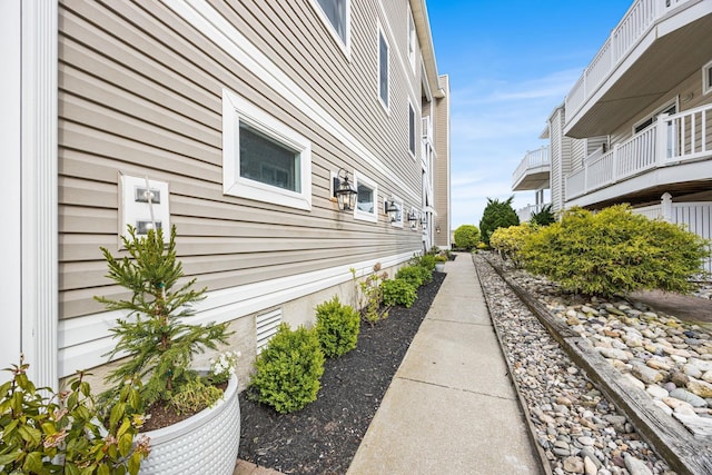 view of side of property with crawl space