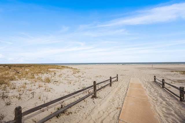 view of water feature with a beach view