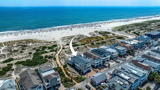 bird's eye view with a beach view and a water view