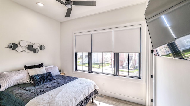 bedroom featuring recessed lighting, ceiling fan, and wood finished floors
