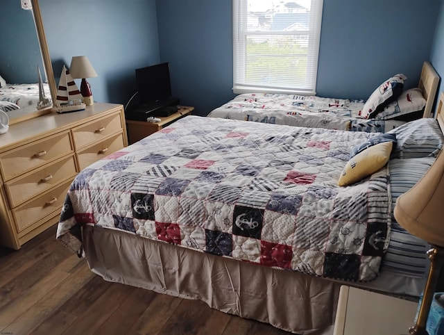 bedroom featuring wood finished floors