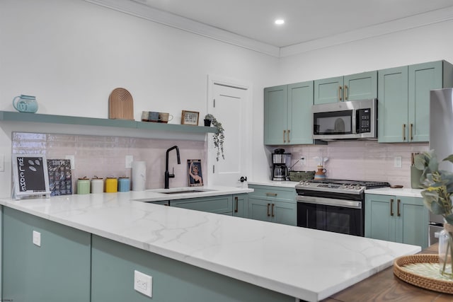 129 Seaside, Atlantic City, NJ 08401 - kitchen featuring a sink, backsplash, open shelves, and appliances with stainless steel finishes