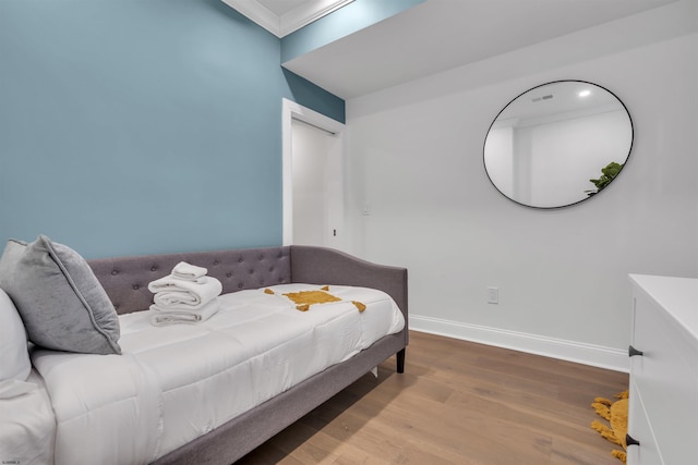 129 Seaside, Atlantic City, NJ 08401 - bedroom with ornamental molding, wood finished floors, and baseboards