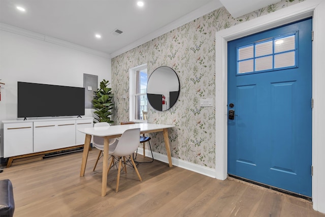129 Seaside, Atlantic City, NJ 08401 - dining space with visible vents, wallpapered walls, ornamental molding, and light wood-type flooring