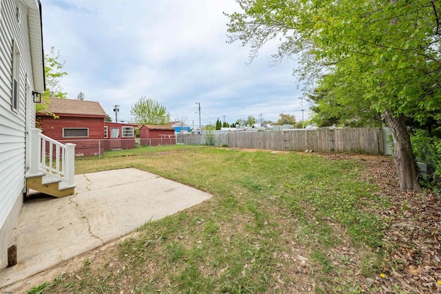 view of yard featuring a patio area and a fenced backyard