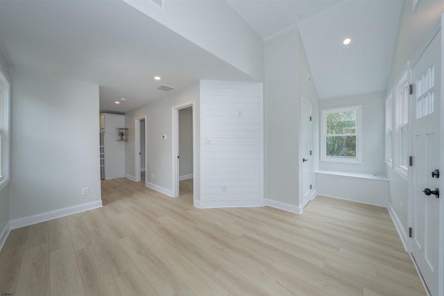 spare room featuring light wood-type flooring, recessed lighting, and baseboards