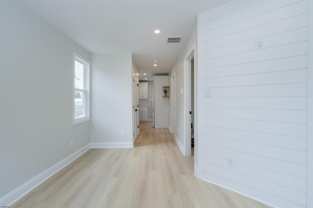 hall with recessed lighting, visible vents, baseboards, and light wood-type flooring