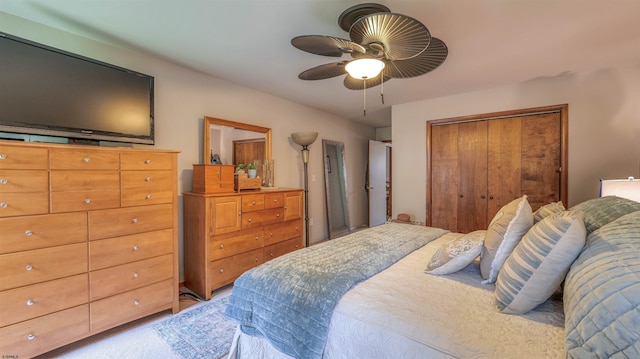 bedroom with a ceiling fan and a closet
