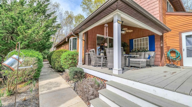 exterior space with a wooden deck and outdoor dining space