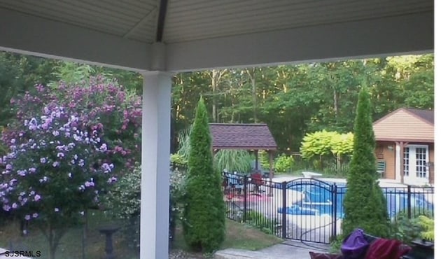 exterior space featuring fence and a gazebo