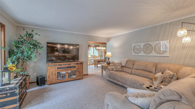 living room featuring baseboards, ornamental molding, and carpet floors