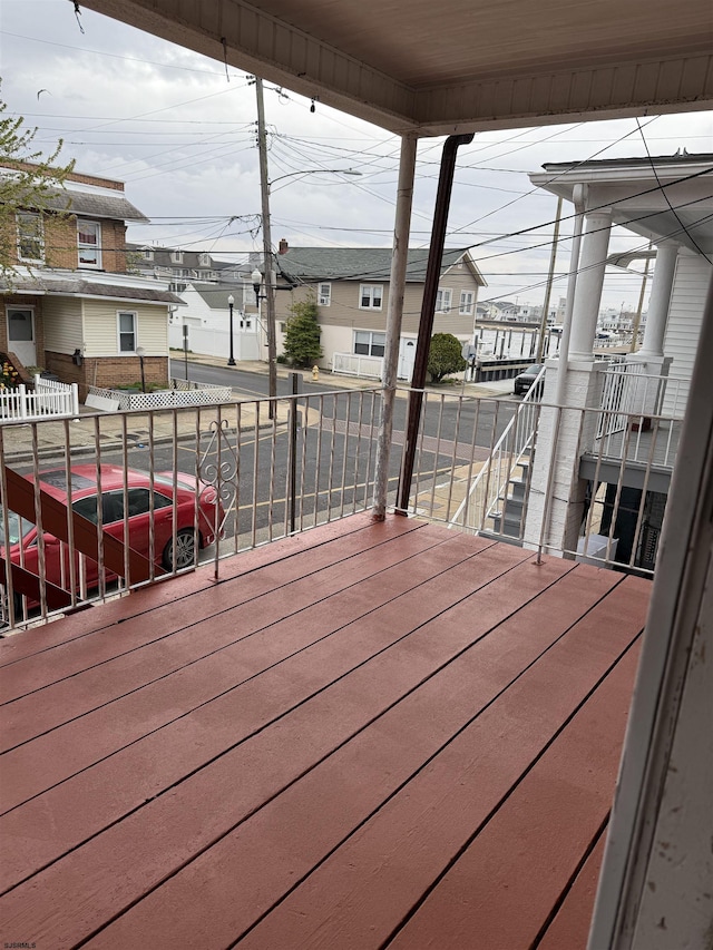 wooden deck with a residential view