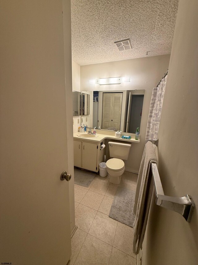 25 Liberty Ct Unit 25, Galloway Township, NJ 08205 - bathroom with visible vents, tile patterned flooring, vanity, toilet, and a textured ceiling