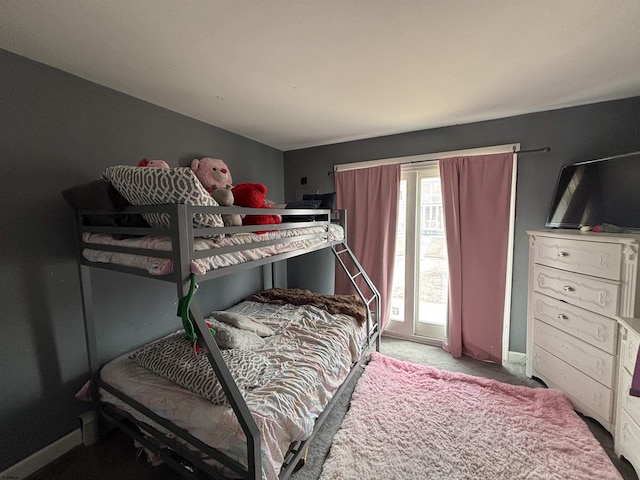 bedroom featuring carpet floors and baseboards
