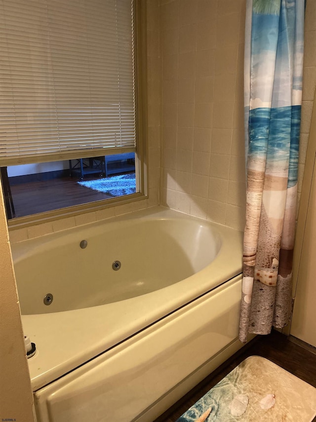 full bath with a jetted tub