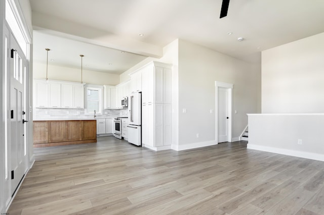 5513 W Ave Fl 1St, Ocean City, NJ 08226 - kitchen featuring white appliances, open floor plan, decorative backsplash, and light wood-style flooring