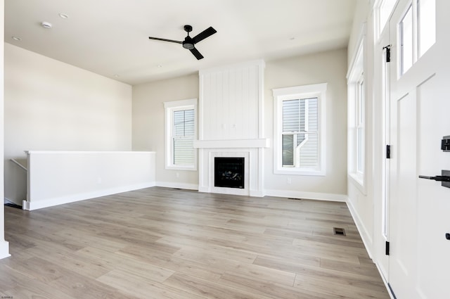 5513 W Ave Fl 1St, Ocean City, NJ 08226 - unfurnished living room featuring a ceiling fan, visible vents, a fireplace, light wood-type flooring, and baseboards