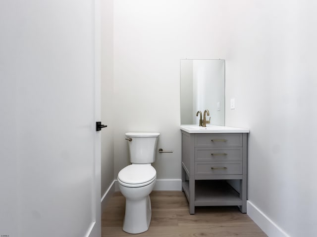 5513 W Ave Fl 1St, Ocean City, NJ 08226 - bathroom featuring vanity, baseboards, toilet, and wood finished floors