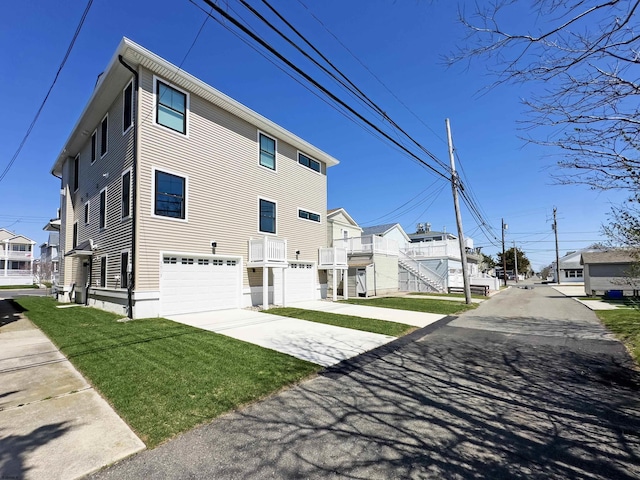 5513 W Ave Fl 1St, Ocean City, NJ 08226 - exterior space with an attached garage, driveway, and a residential view