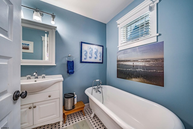 226 Asbury Ave, Ocean City, NJ 08226 - bathroom featuring tile patterned floors, a freestanding bath, baseboards, and vanity