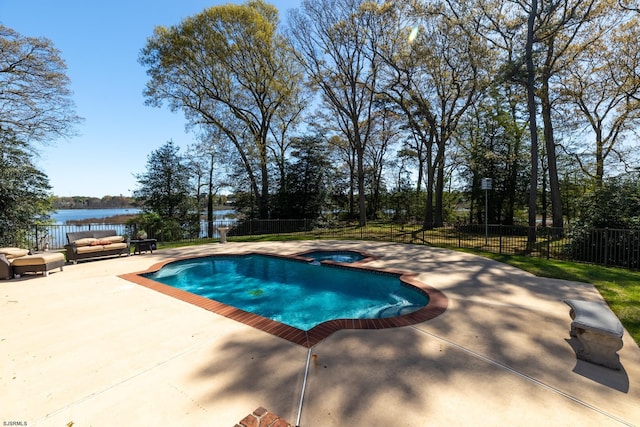 view of pool featuring an outdoor hangout area, an in ground hot tub, a patio area, and a fenced backyard