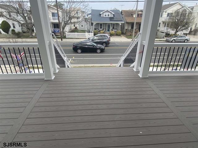 1243 Bay Ave, Ocean City, NJ 08226 - wooden terrace with a residential view and a porch