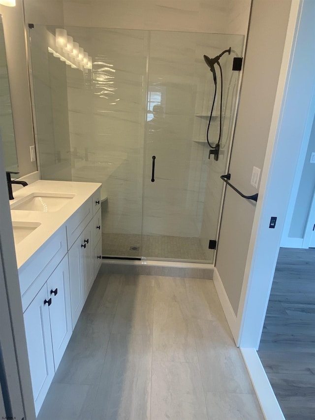 1243 Bay Ave, Ocean City, NJ 08226 - full bath featuring a sink, baseboards, a stall shower, and double vanity