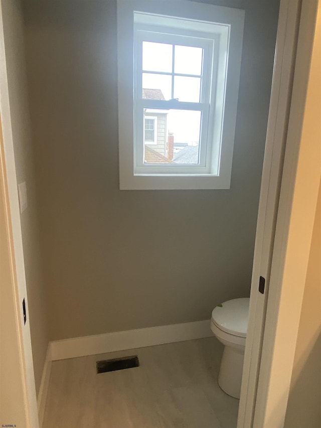 1243 Bay Ave, Ocean City, NJ 08226 - bathroom featuring baseboards, toilet, and visible vents