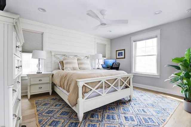 bedroom with baseboards, recessed lighting, a ceiling fan, and wood finished floors