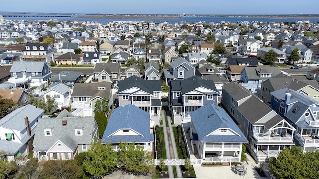birds eye view of property with a residential view