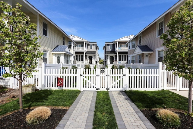 surrounding community featuring a residential view, a gate, and fence private yard