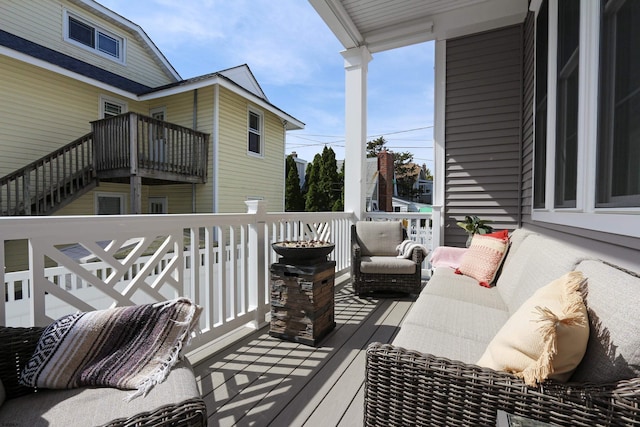 wooden terrace with outdoor lounge area