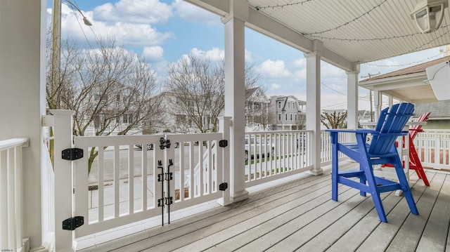 wooden deck featuring a residential view