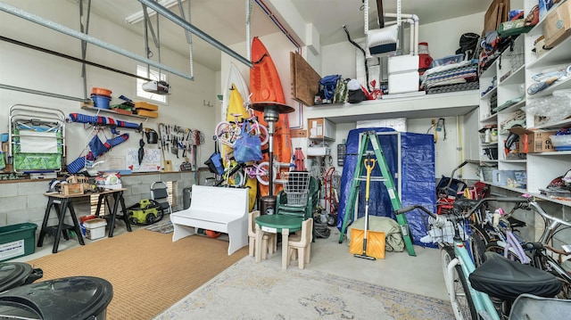 garage featuring a workshop area and a garage door opener