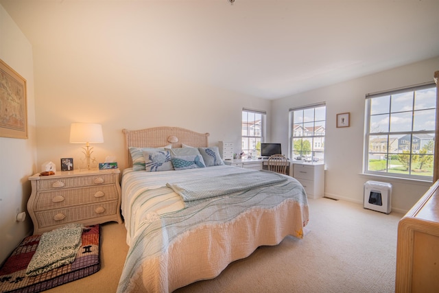 bedroom featuring light carpet