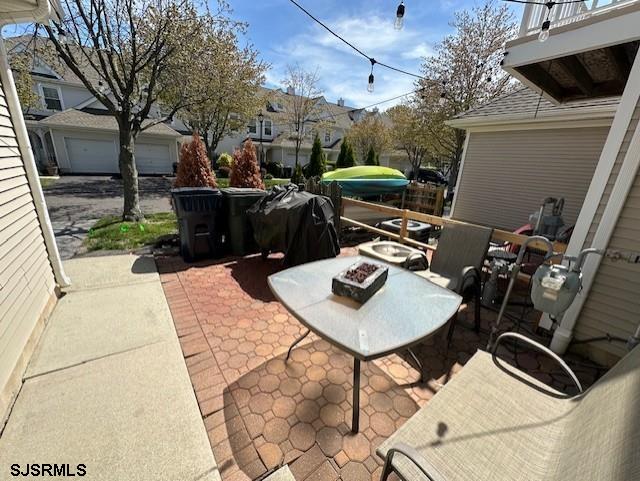 view of patio / terrace with a fire pit
