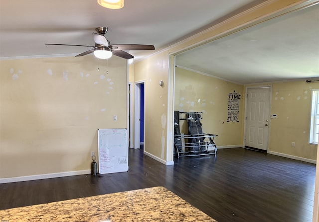 living area featuring baseboards, a ceiling fan, wood finished floors, and ornamental molding