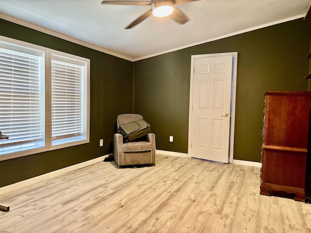 unfurnished room featuring ceiling fan, ornamental molding, baseboards, and light wood finished floors