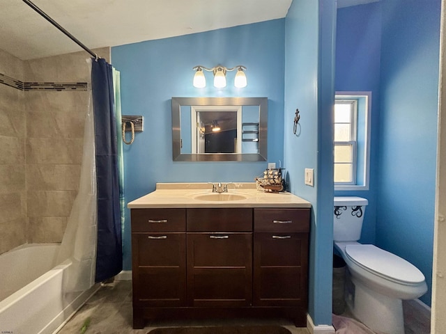 full bath with vanity, shower / bath combo, and toilet