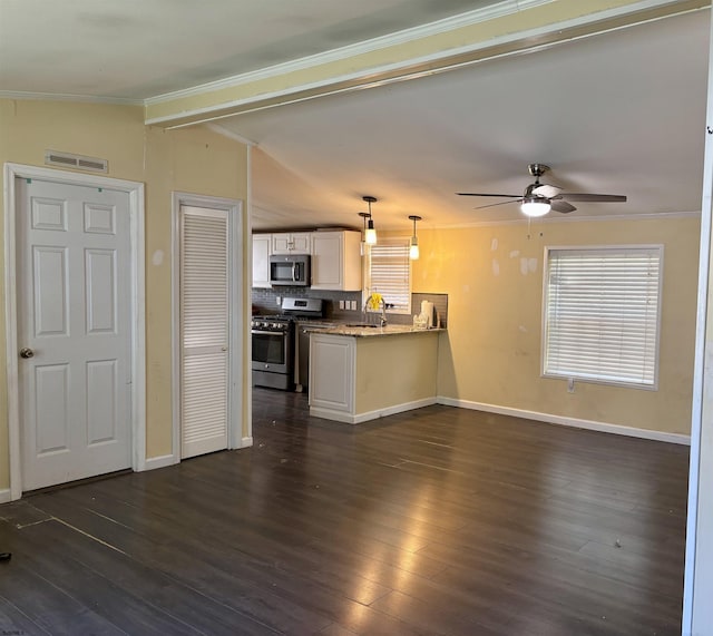 unfurnished living room featuring ceiling fan, visible vents, crown molding, a sink, and lofted ceiling