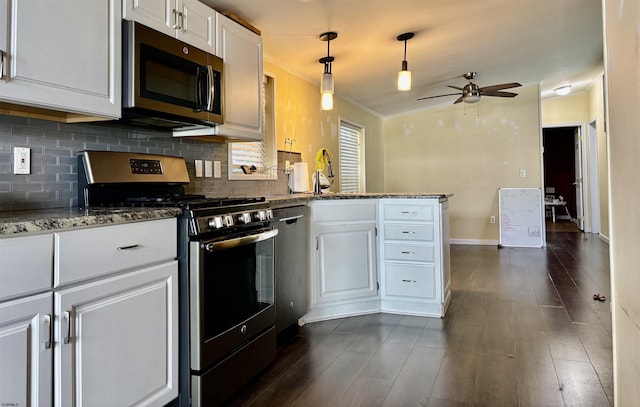 kitchen with ceiling fan, stainless steel appliances, white cabinetry, a peninsula, and tasteful backsplash