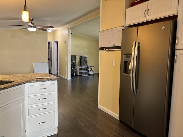 kitchen featuring ceiling fan, dark wood finished floors, stainless steel fridge with ice dispenser, baseboards, and white cabinets